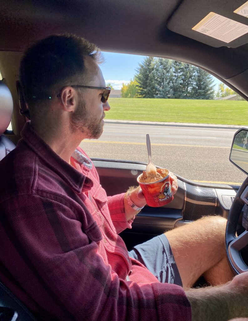 Where to eat and shop at Rocky mountains - Zac is having an ice cream whilst driving 