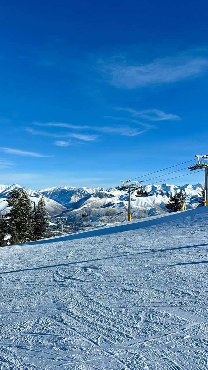 Groomed runs on Bald Mountain Sun Valley with chairlift and Sawtooth Range