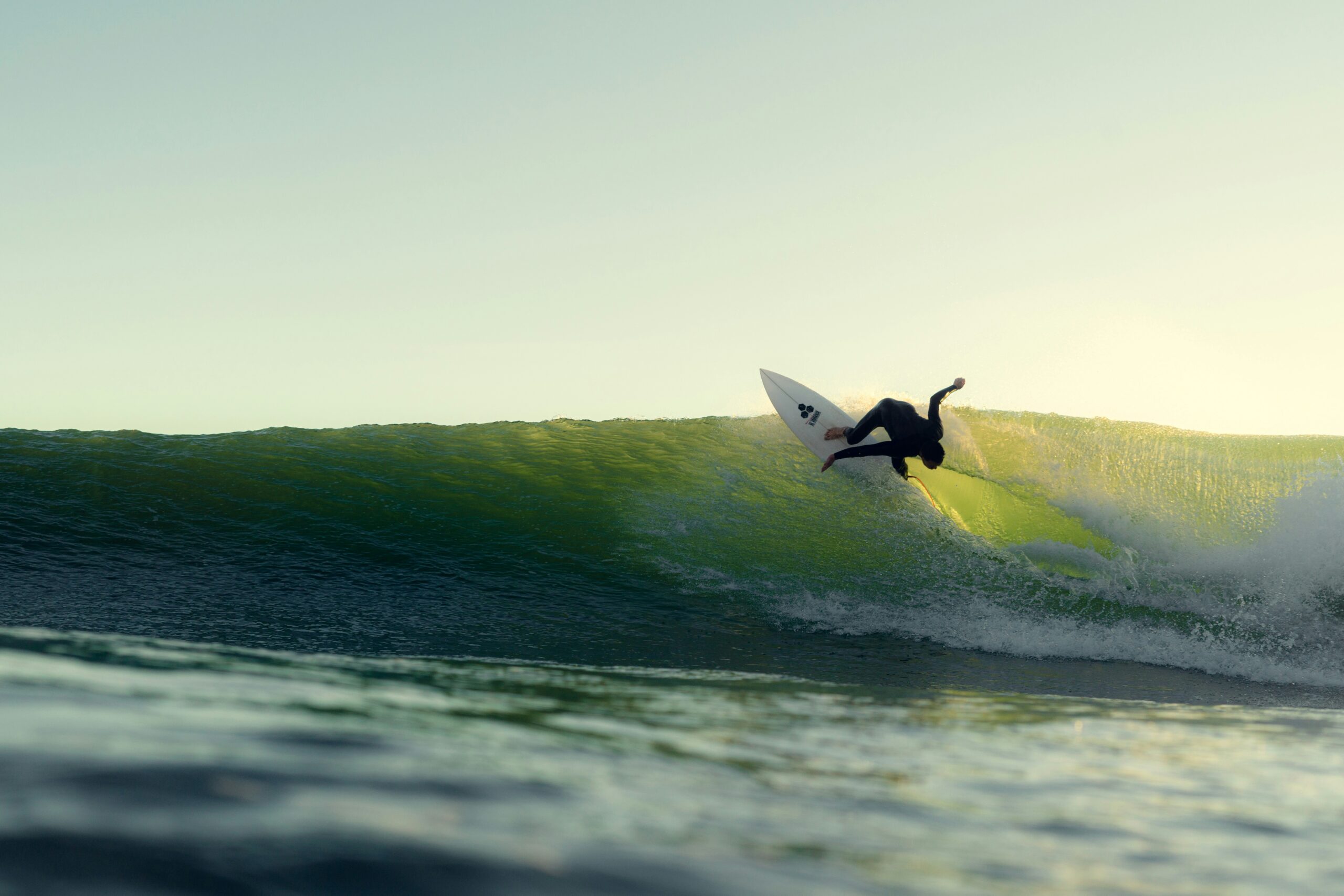 Surfer carving a clean wave on the Southern California coast